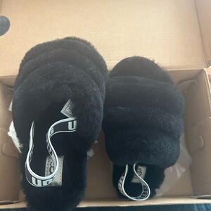 Black furry Ugg slides